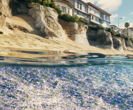 This illustration shows a grid of blue lines in the water along a coastline on which houses rest on sandy cliffs above. The blue color illustrates the use of low-voltage electricity to turn sand into stone and protect the coast from erosion.